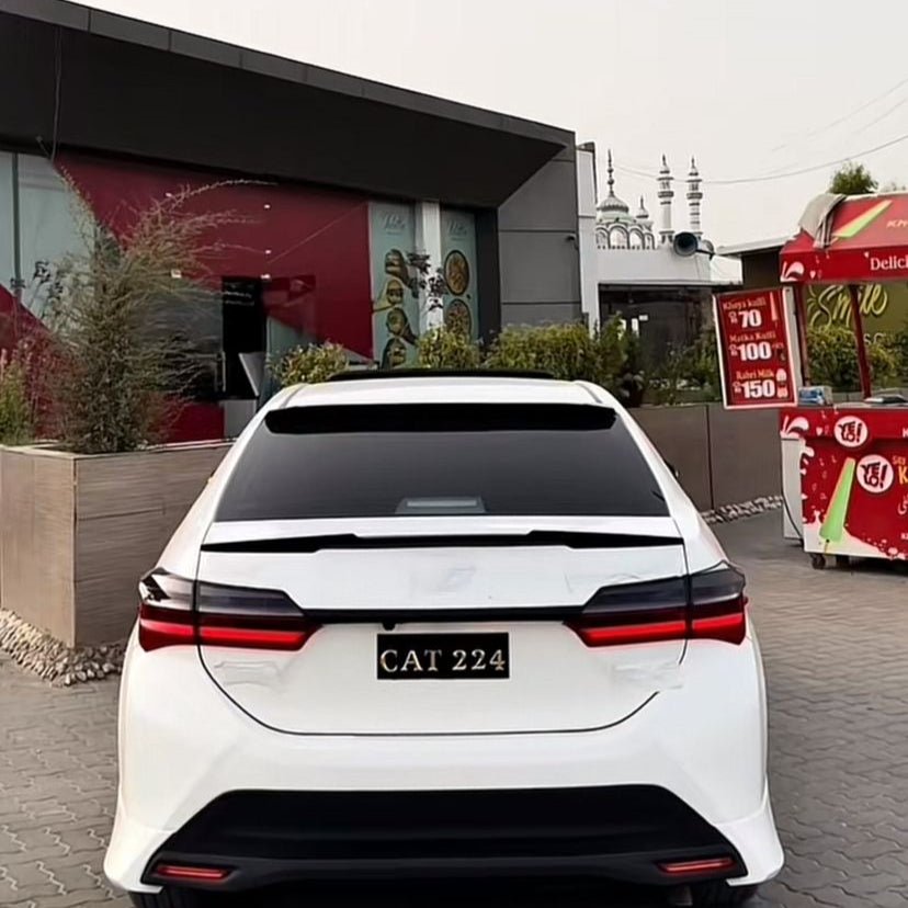 CORROLLA GRANDE ALTIS - RS SPOILER - ABS PLASTIC PREMIUM QUALITY - GLOSSY Black PaintedRaja Autos.pk